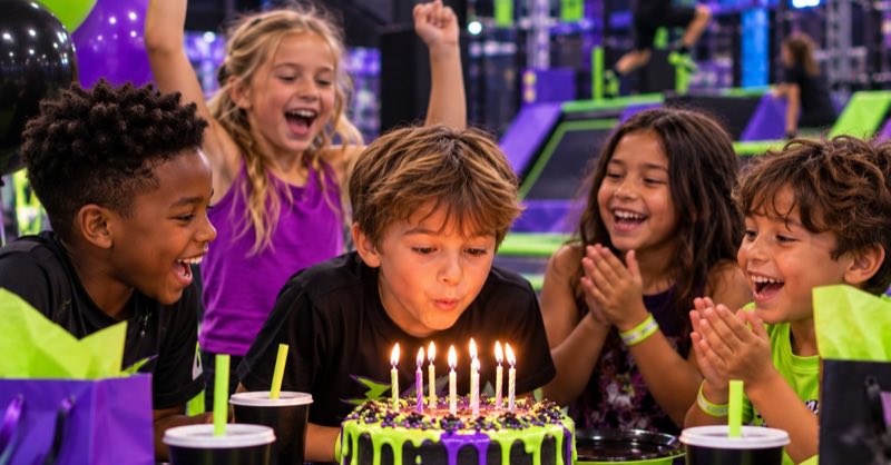 Kids cheering as the birthday child blows out candles at a VOLT party